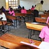Primary pupils in a PLE examination set up in Moroto