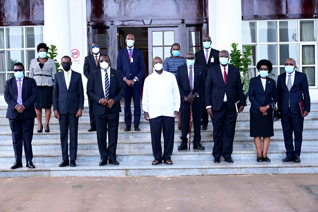 President Museveni poses for a photo with other government officials