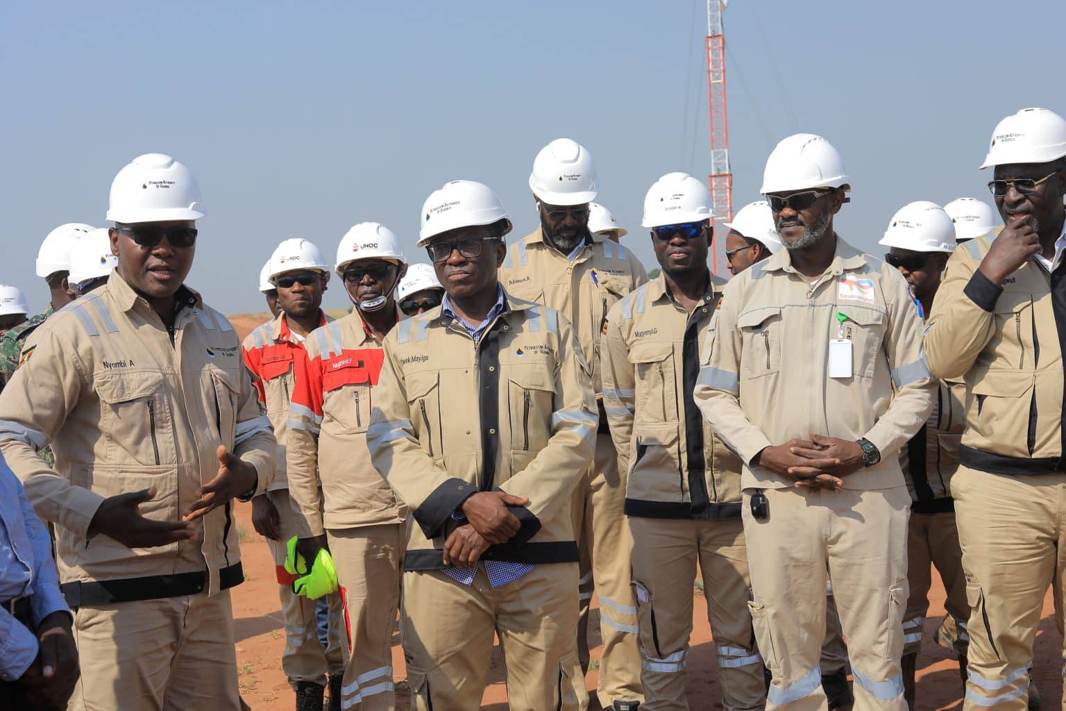 Peter Mayiga poses with oil engineers