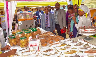 Kabanekera Annet form the bakery class (right) shows a variety of products they can make this was during the Presidential Initiative on skilling the Girl/Boy Child project 7th intake inspection of the skills of the students as they show case their work at Sub-way Centre on 23rd February 2023. Photo by PPU/Tony Rujuta.