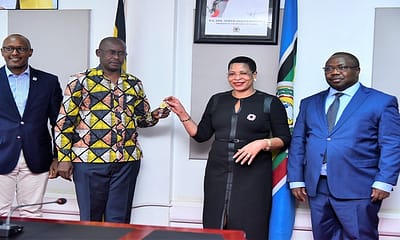 A-picture-of-the-Speaker-of-Parliament-handing-over-keys-to-the-radio-equipment-to-MD-UBC-Agaba-Winston-in-the-presence-of-the-Clerk-to-Parliament-and-Depty-MD-UBC-Maurice-Mugisha