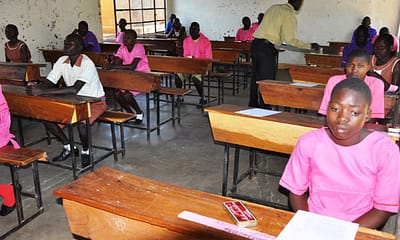 Primary pupils in a PLE examination set up in Moroto