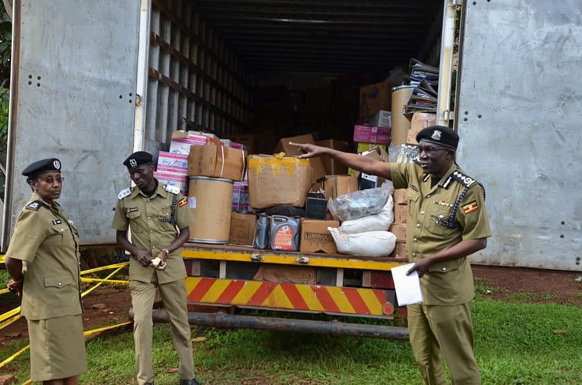 Police with counterfeit goods ready to destroy.